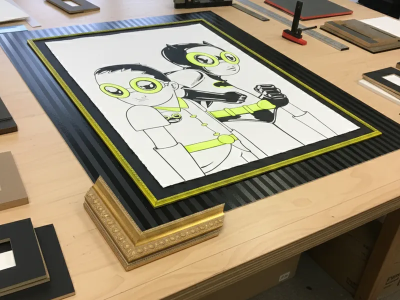 Craftsman working on picture frame in workshop